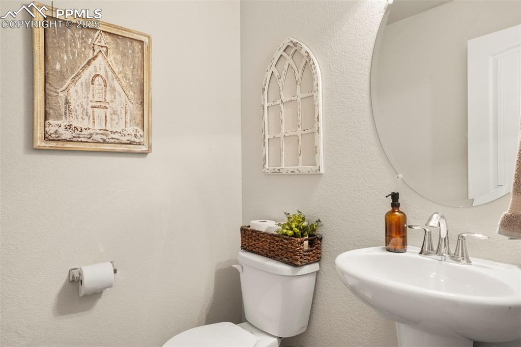 Image 15 of 36: 1/2 Bathroom on stair landing