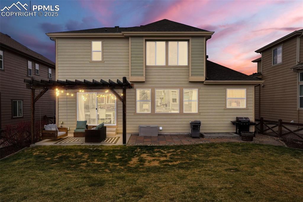 Image 29 of 36: Rear view of property featuring a pergola, central AC unit, a patio area, a