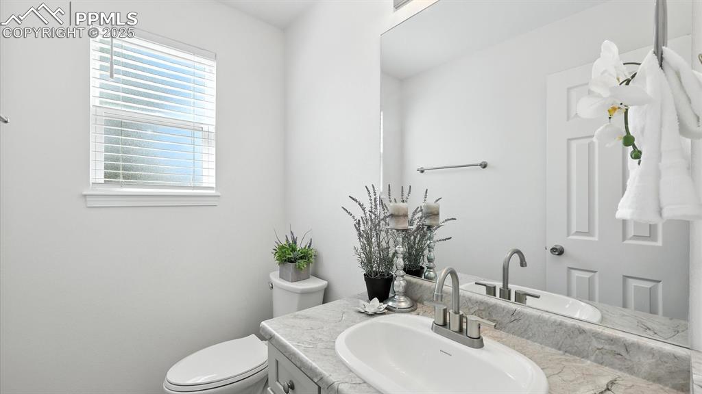 Image 12 of 50: Convenient Powder Bathroom.