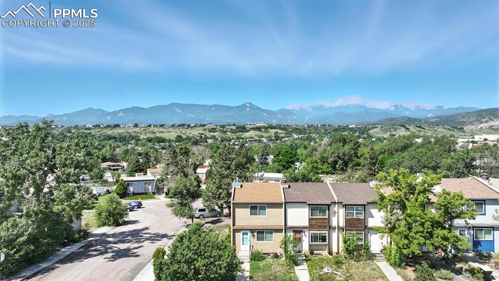Image 2 of 50: Front view of home with gorgeous mtn and Peak views!