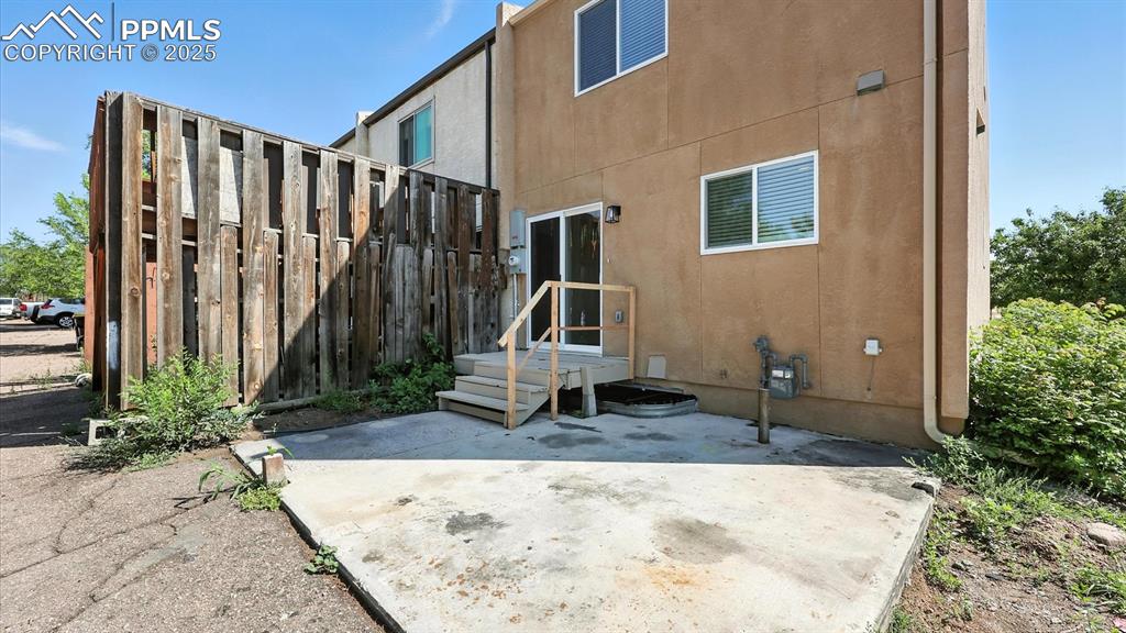 Image 20 of 50: Private concrete pad at the back of the unit for parking or outdoor activit