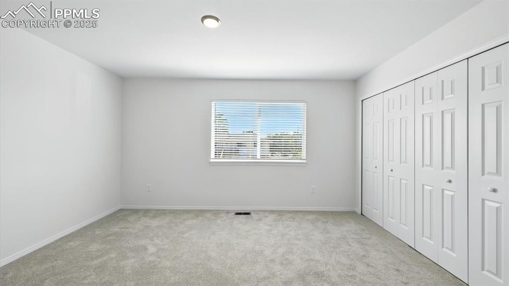 Image 25 of 50: The upper level Primary Bedroom provides double closets for ample wardrobe 