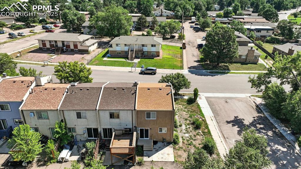 Image 47 of 50: Aerial view of townhome community and quiet treed neighborhood.