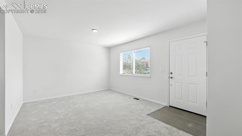 Image 8 of 50: Welcoming Entry into the Living Room.