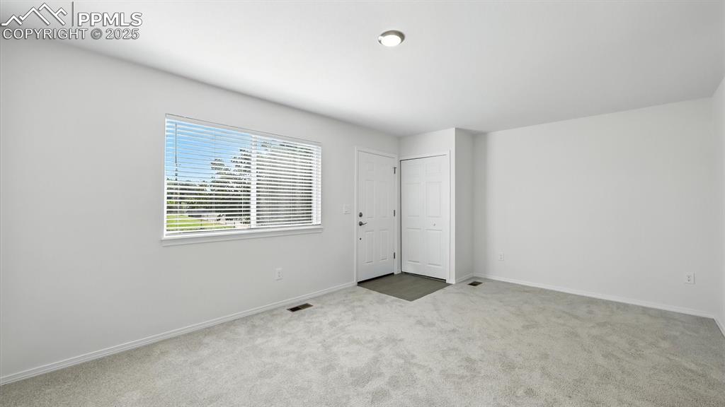 Image 9 of 50: The Entry offers a convenient coat closet and access into the Living Room.