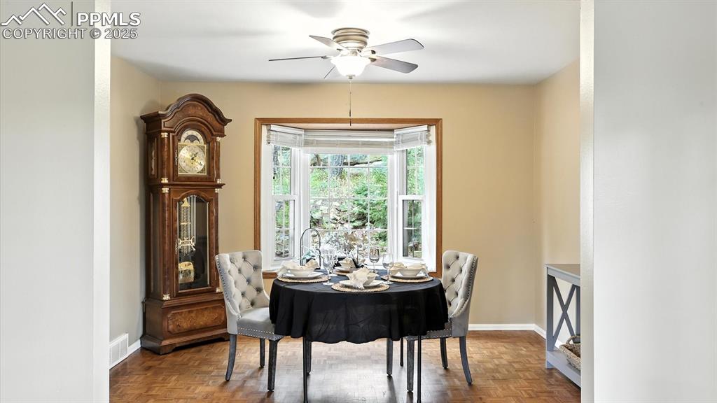 Image 11 of 50: Beautiful bay window in the Formal Dining Room with views of the backyard.
