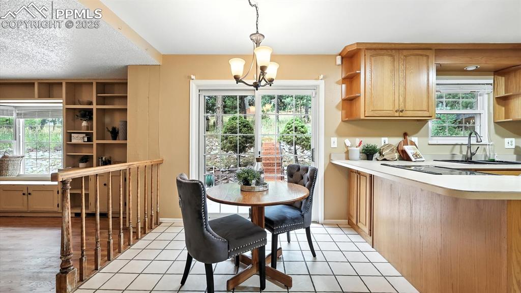 Image 16 of 50: Kitchen Dining Nook for informal dining with a slider to the backyard patio