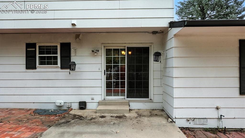 Image 17 of 50: Backyard concrete and brick patio located off the Dining Nook.