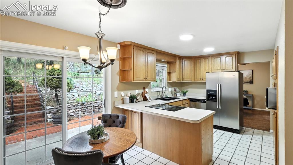 Image 19 of 50: View into the Kitchen from the Dining Nook.