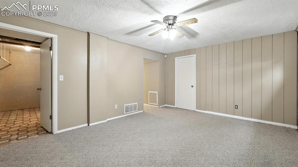 Image 37 of 50: Basement Family Room into the Laundry Room.