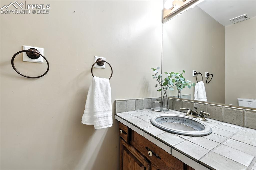 Image 7 of 50: Convenient main level powder bathroom.