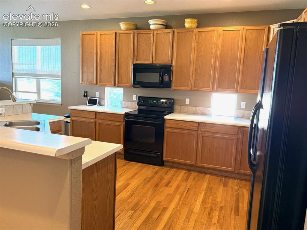 Image 10 of 42: Kitchen small windows let in extra natural light