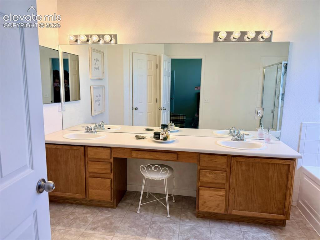 Image 18 of 42: Master bathroom double vanity
