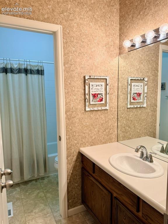 Image 25 of 42: Hall full bath