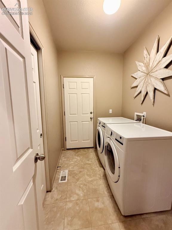 Image 27 of 42: Laundry room off garage
