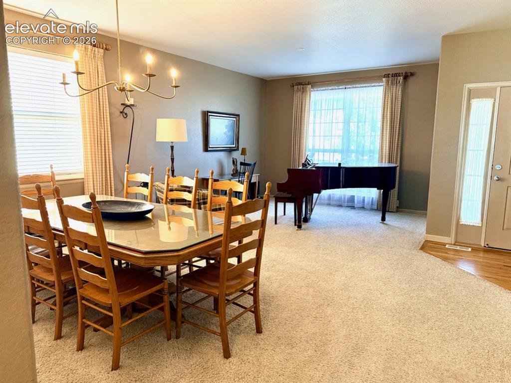 Image 29 of 42: Living room and dining room combo