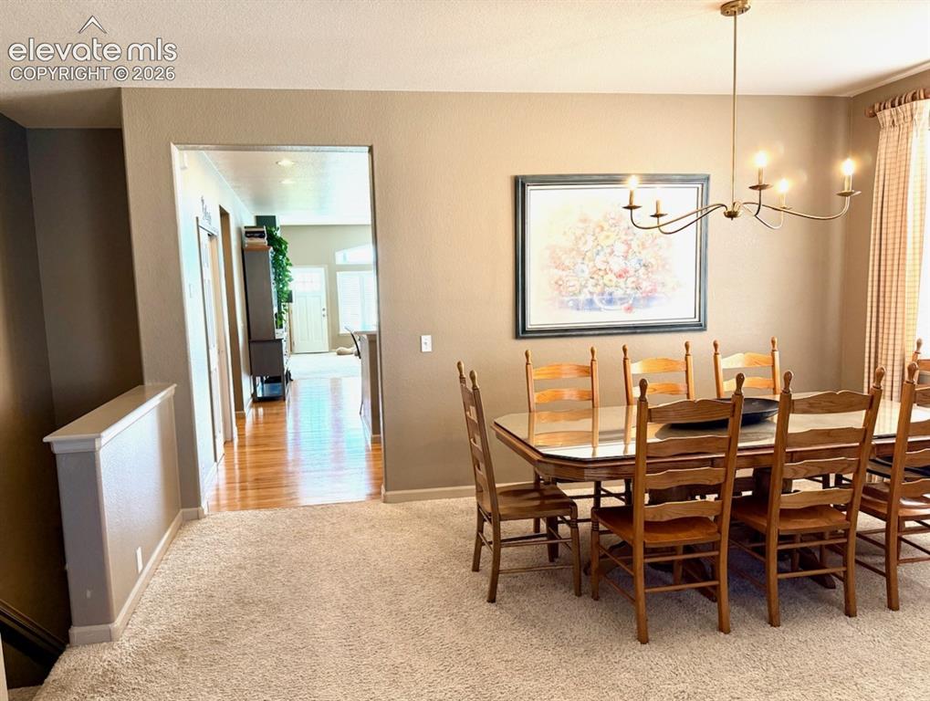 Image 30 of 42: Formal dining space