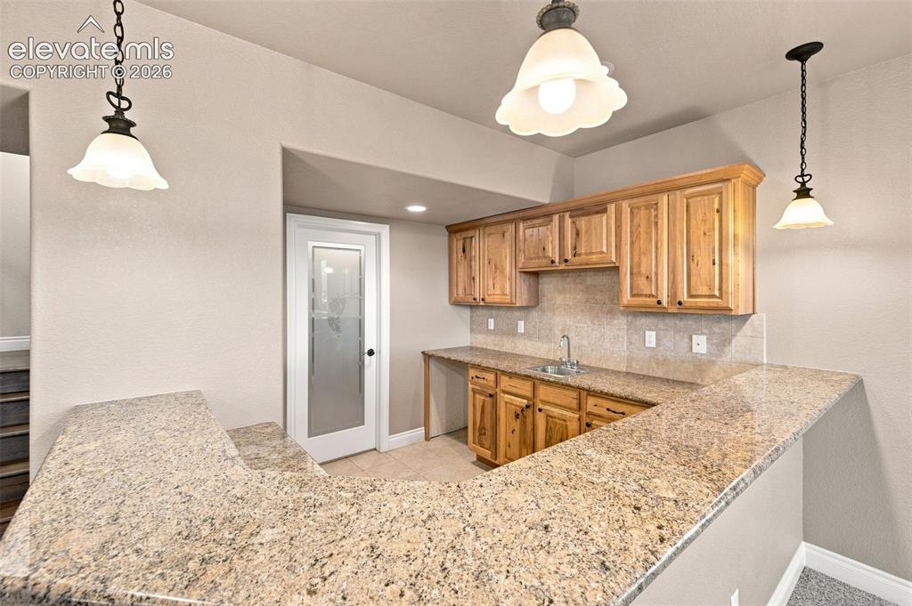 Image 29 of 47: Spacious Wet Bar and Wine Cellar!