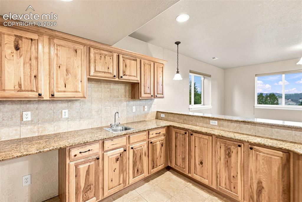 Image 33 of 47: Large Wet bar with granite and space for entertainment!