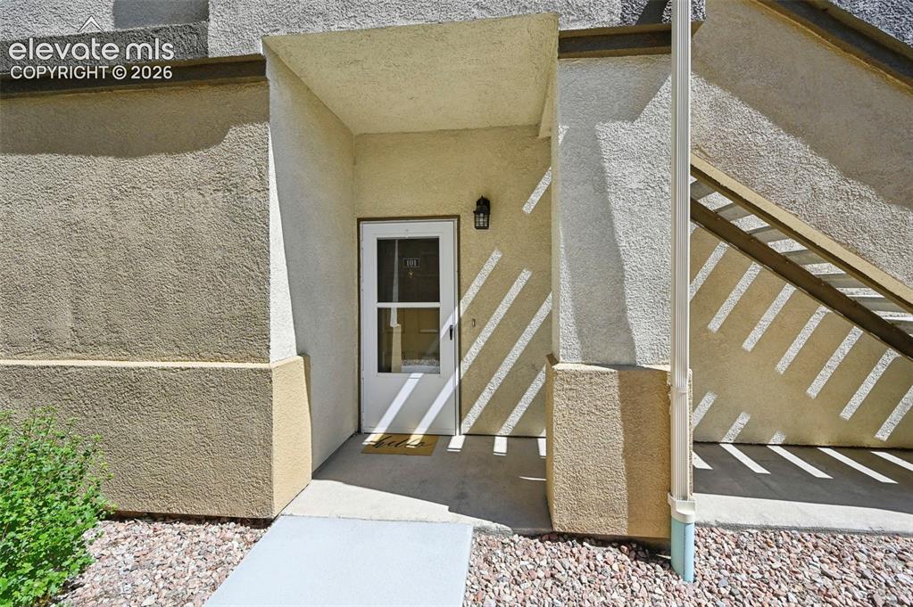 Image 6 of 36: Entryway featuring a white door with glass inserts, recessed overhead light