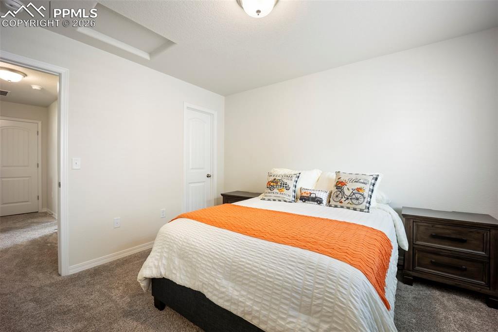 Image 28 of 38: Upper bedroom