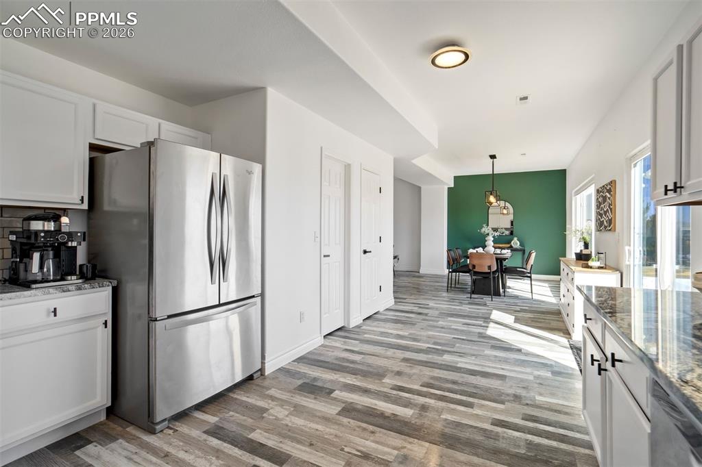 Image 15 of 46: Kitchen with a coffee nook & a pantry.