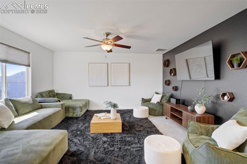 Image 18 of 46: The large loft is the ultimate flex space.