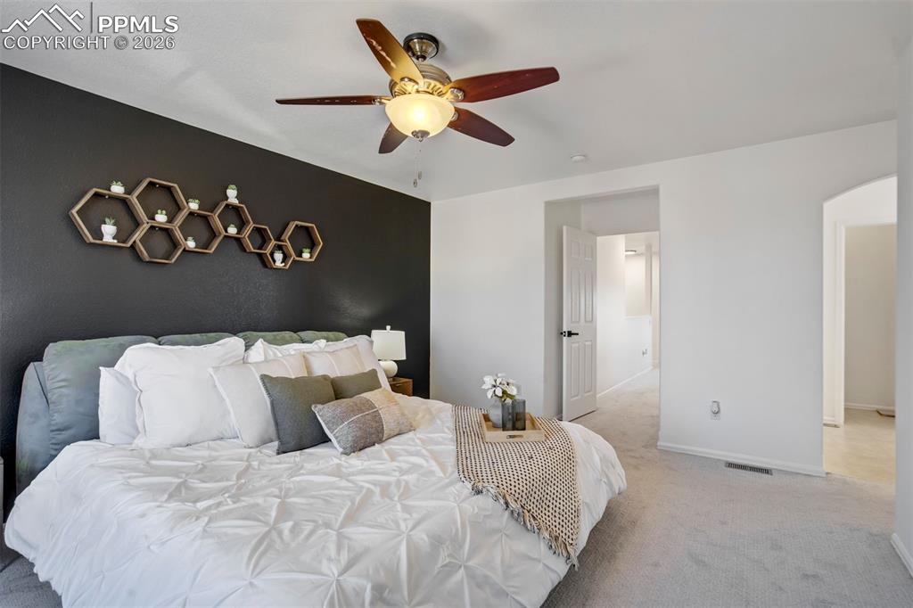 Image 24 of 46: A primary suite that says, “you’ve earned this.”