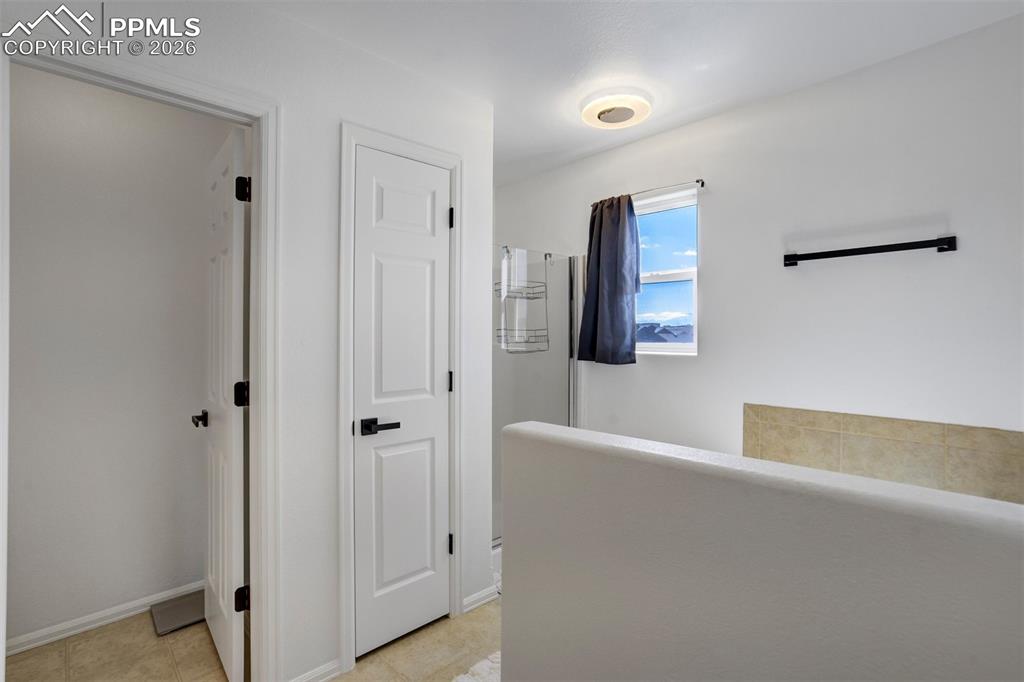 Image 27 of 46: Standing shower, private water closet, linen closet, and a soaking tub. I t