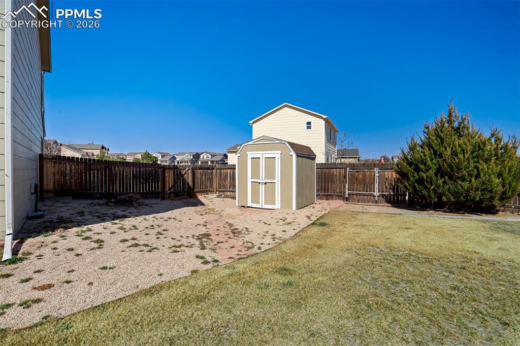 Image 40 of 46: Side yard with a shed.
