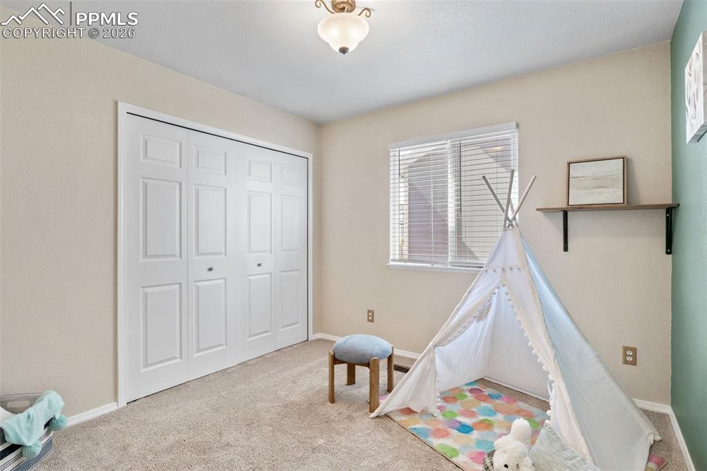 Image 23 of 50: Recreation room featuring carpet floors and baseboards