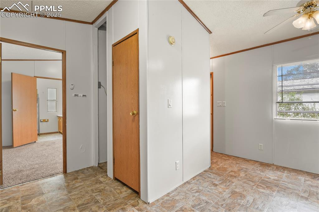Image 15 of 29: Dining with laundry area tucked behind wall