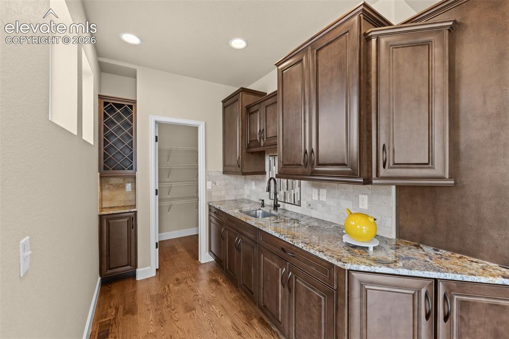 Image 15 of 50: Wet Bar and Pantry off kitchen