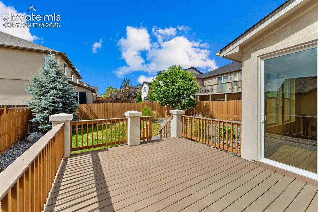 Image 43 of 50: composite deck off of the dining and living space
