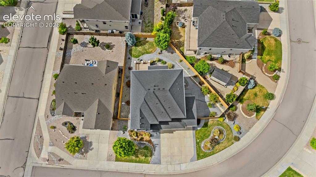 Image 46 of 50: overhead lot view of home footprint and full landscape features