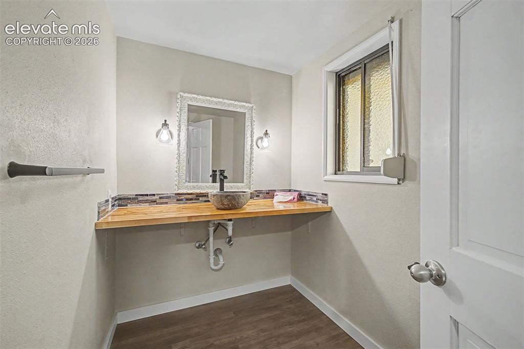 Image 11 of 29: Updated and unique half bath on the main level