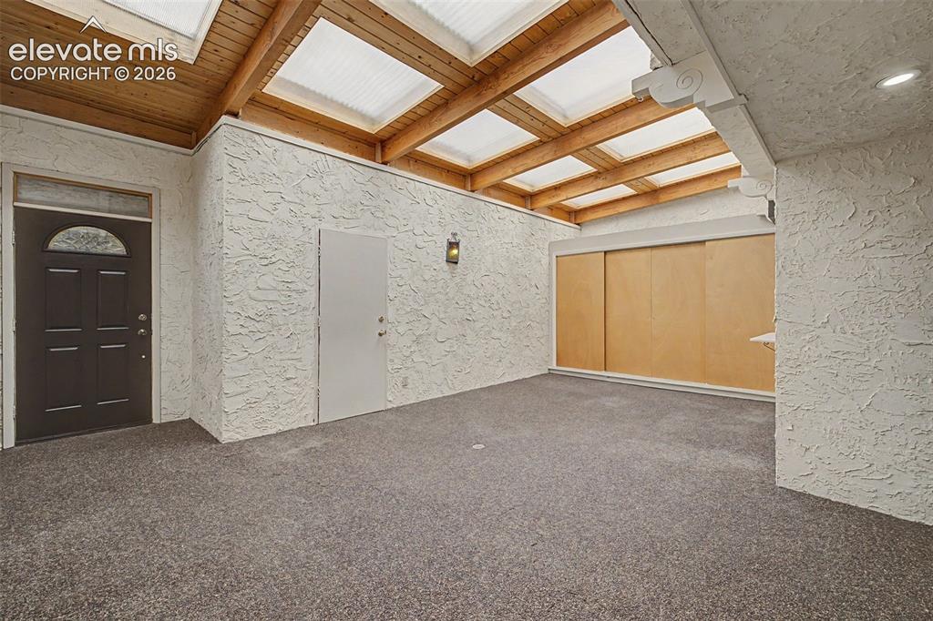 Image 6 of 29: Enclosed Entry/courtyard with endless possibilities
