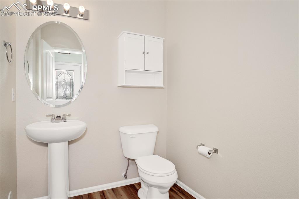 Image 15 of 26: Main level powder room.