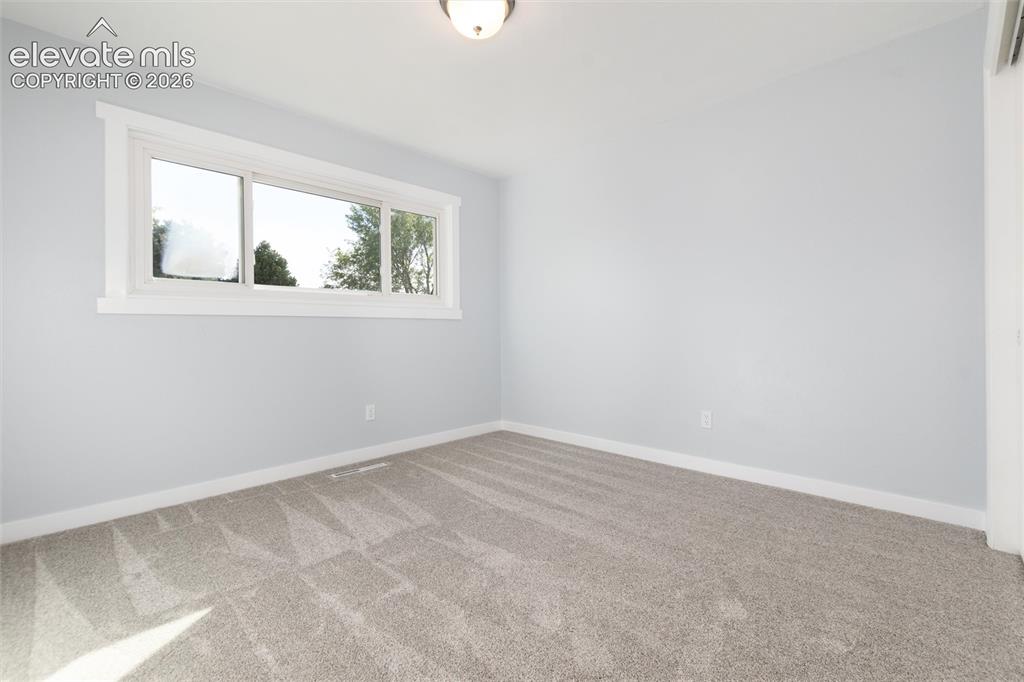 Image 31 of 47: Light gray wall paint, white trim, recessed window with white framing, neut