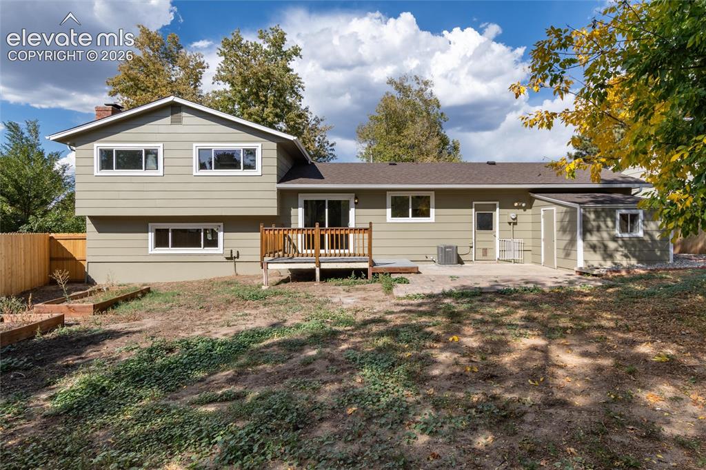 Image 40 of 47: Expansive property featuring a rear deck, a patio, a detached shed, a wood