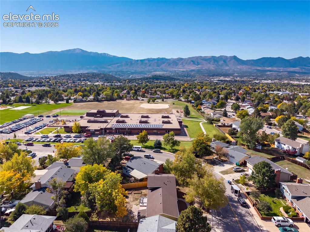Image 43 of 47: Mountain range backdrop, residential neighborhood setting, broad expanse of
