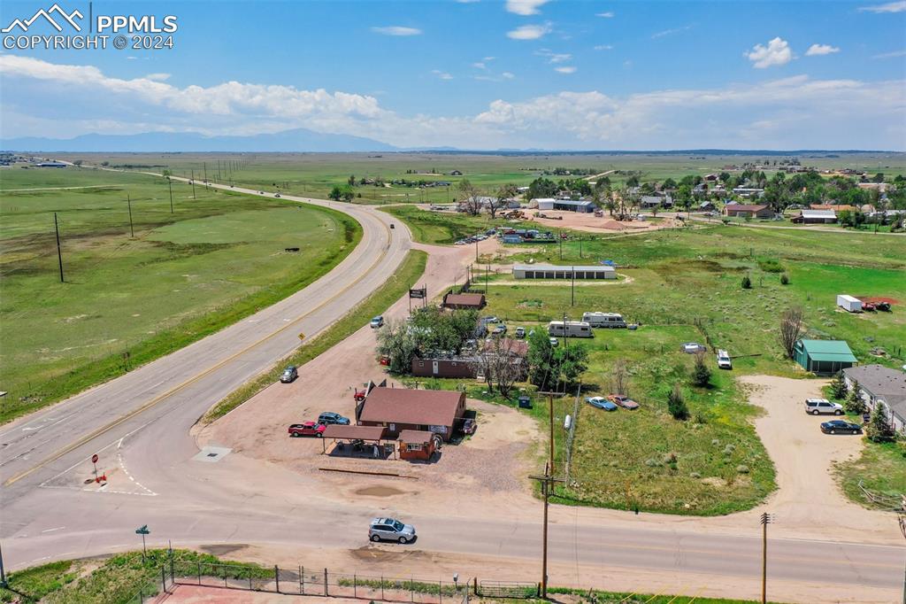 Image 27 of 49: Drone / aerial view featuring a rural view and a mountain view