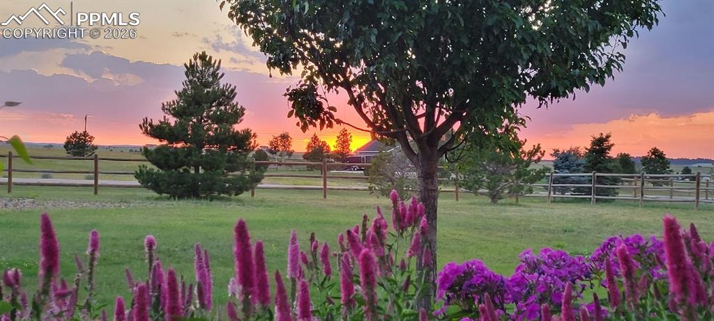 Image 2 of 32: Yard at dusk featuring a view of countryside
