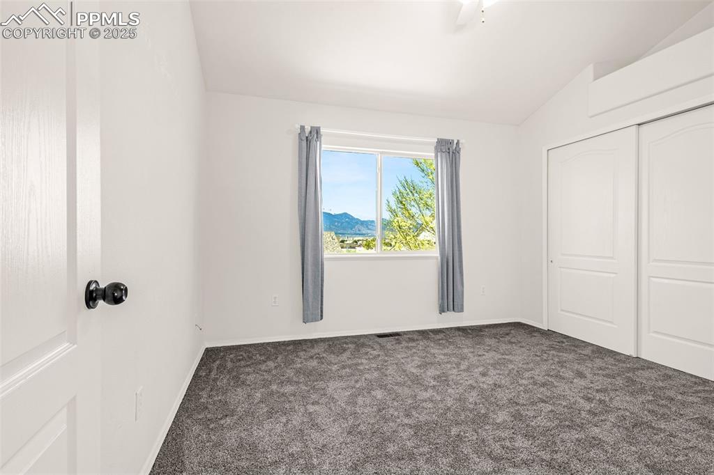 Image 10 of 17: Bedroom featuring mountain views from the window