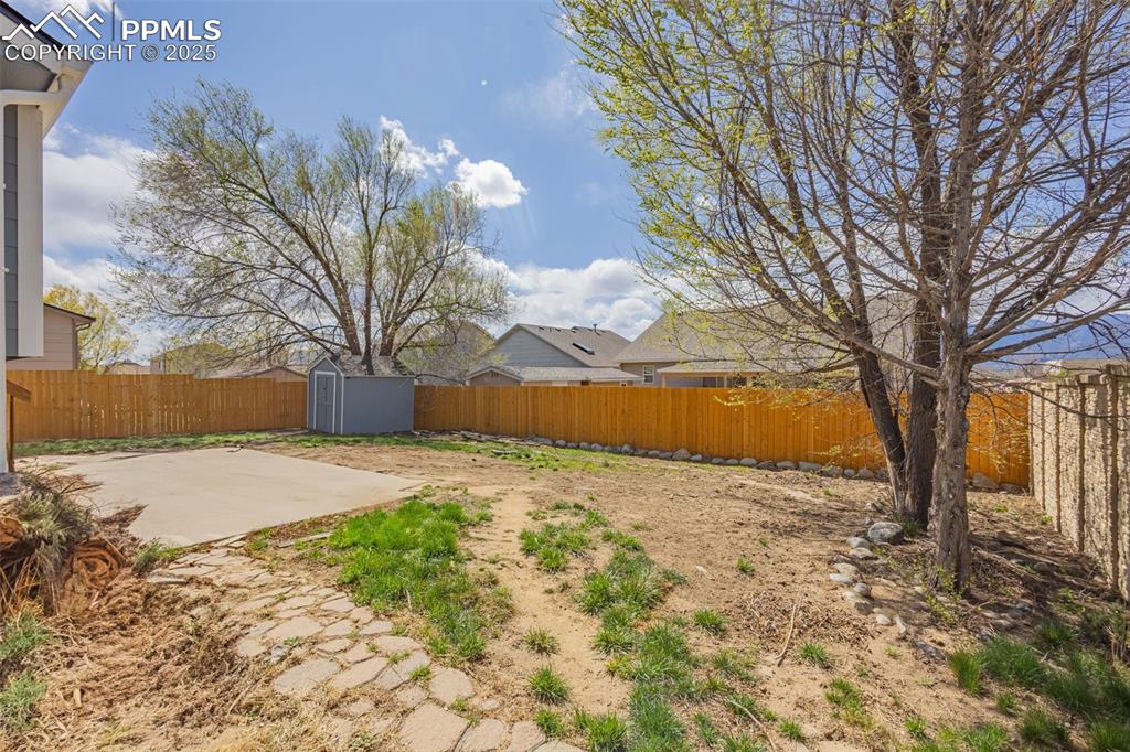 Image 17 of 17: Mountain views from backyard. featuring new fencing and shed.