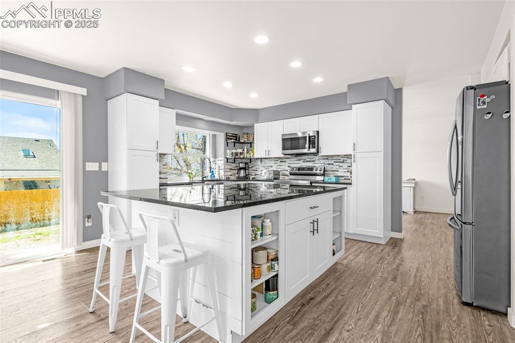 Image 3 of 17: Newly renovated kitchen with granite counter tops and stainless steel appli