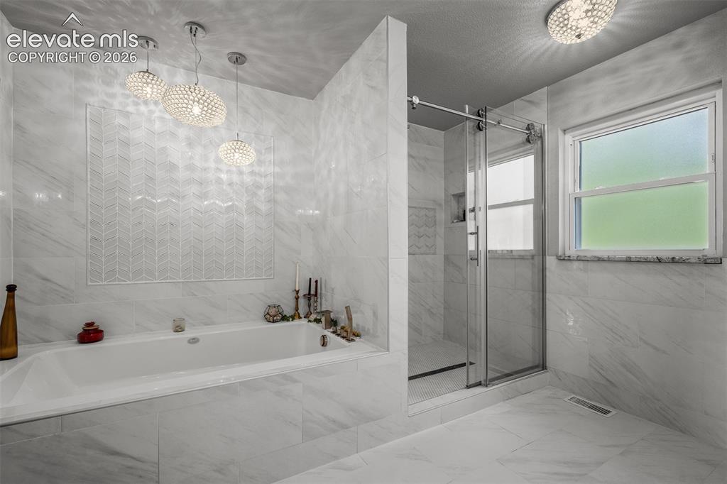 Image 18 of 50: Master Bathroom