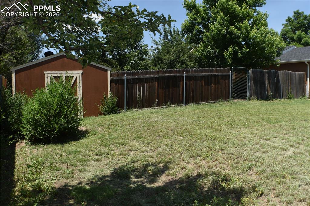 Image 34 of 40: View of yard featuring a storage shed