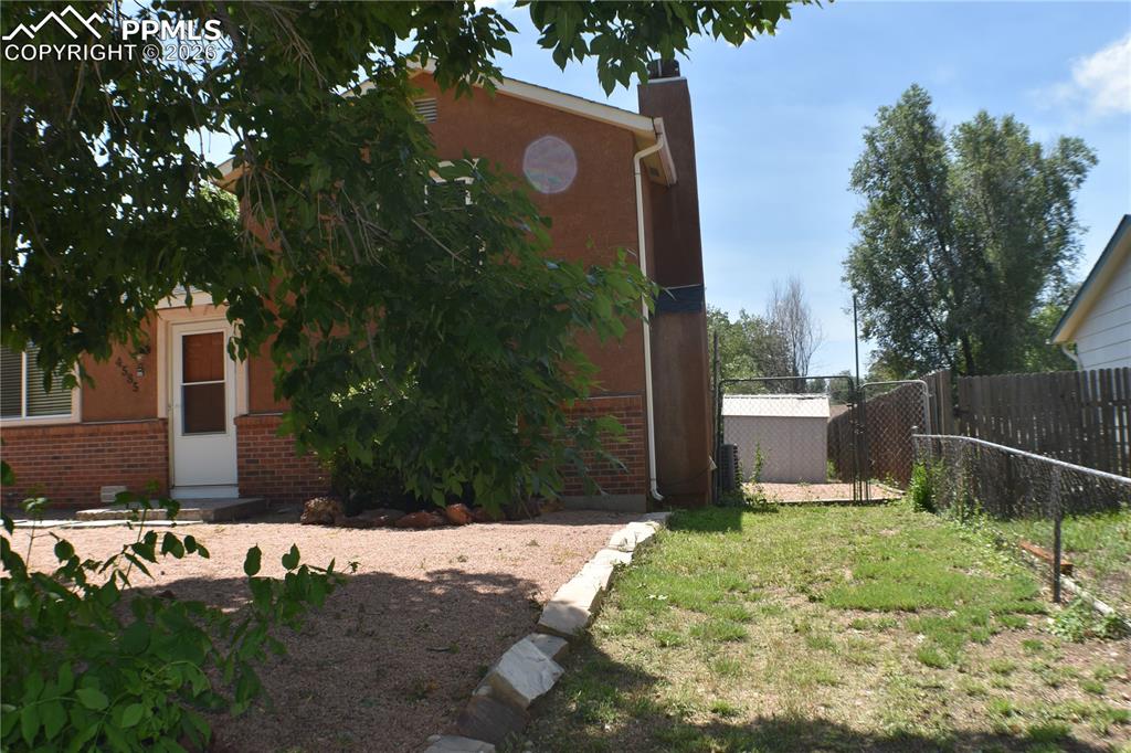 Image 40 of 40: View of front side of yard