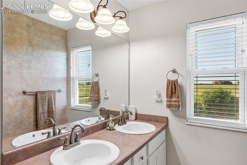 Image 14 of 44: Full bath featuring double vanity